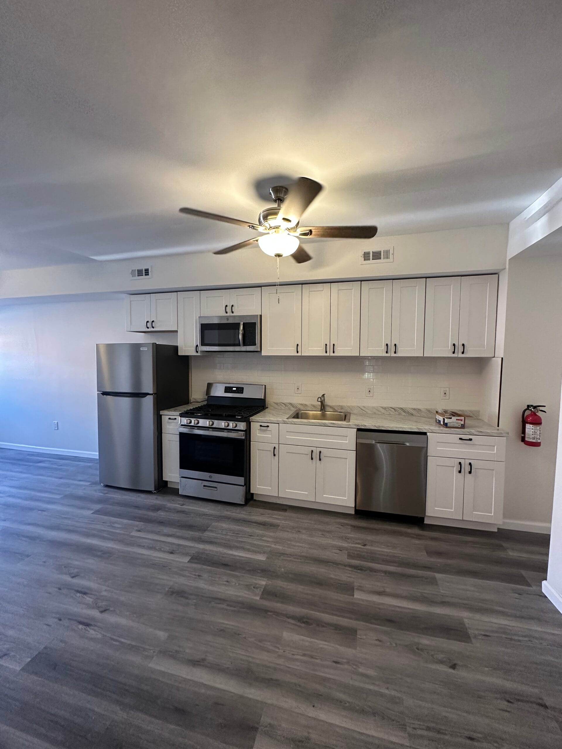 Updated room from the Fairview remodel with fresh paint and flooring