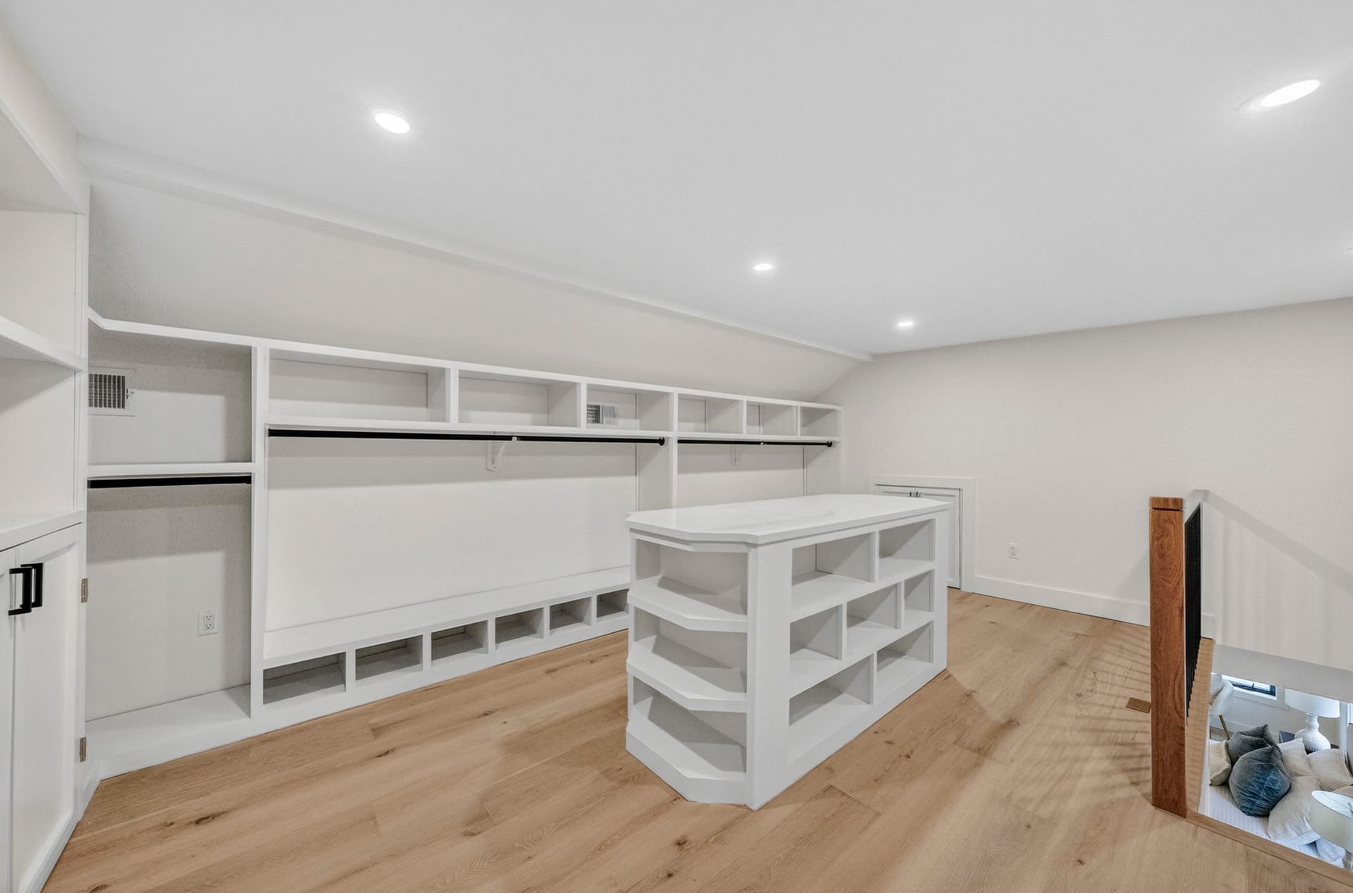 Walk-in closet with custom built-ins and a center storage island
