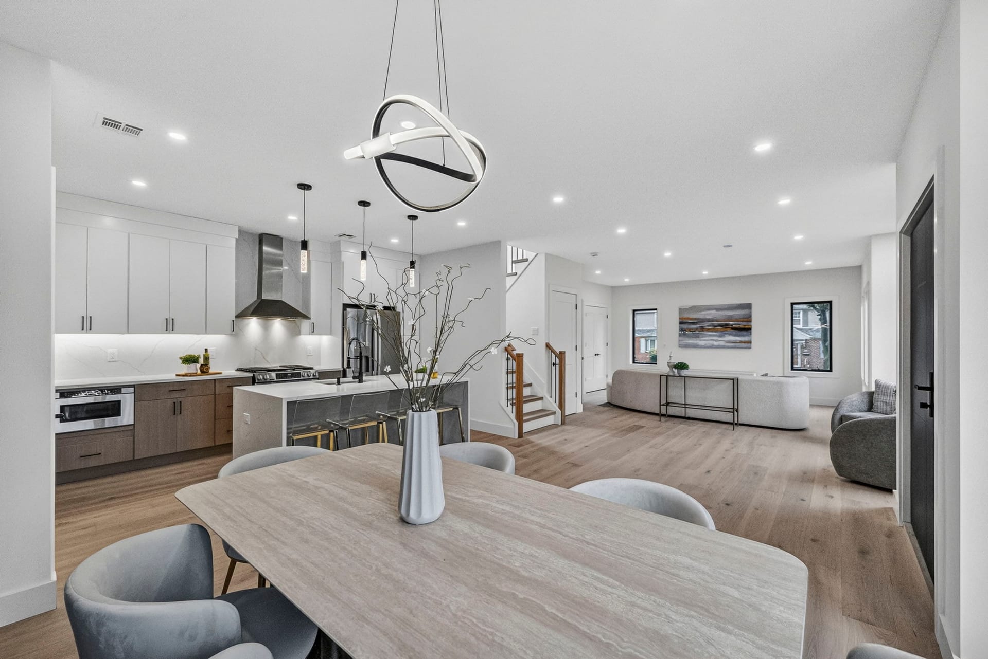 Open-concept kitchen and living area with a waterfall island