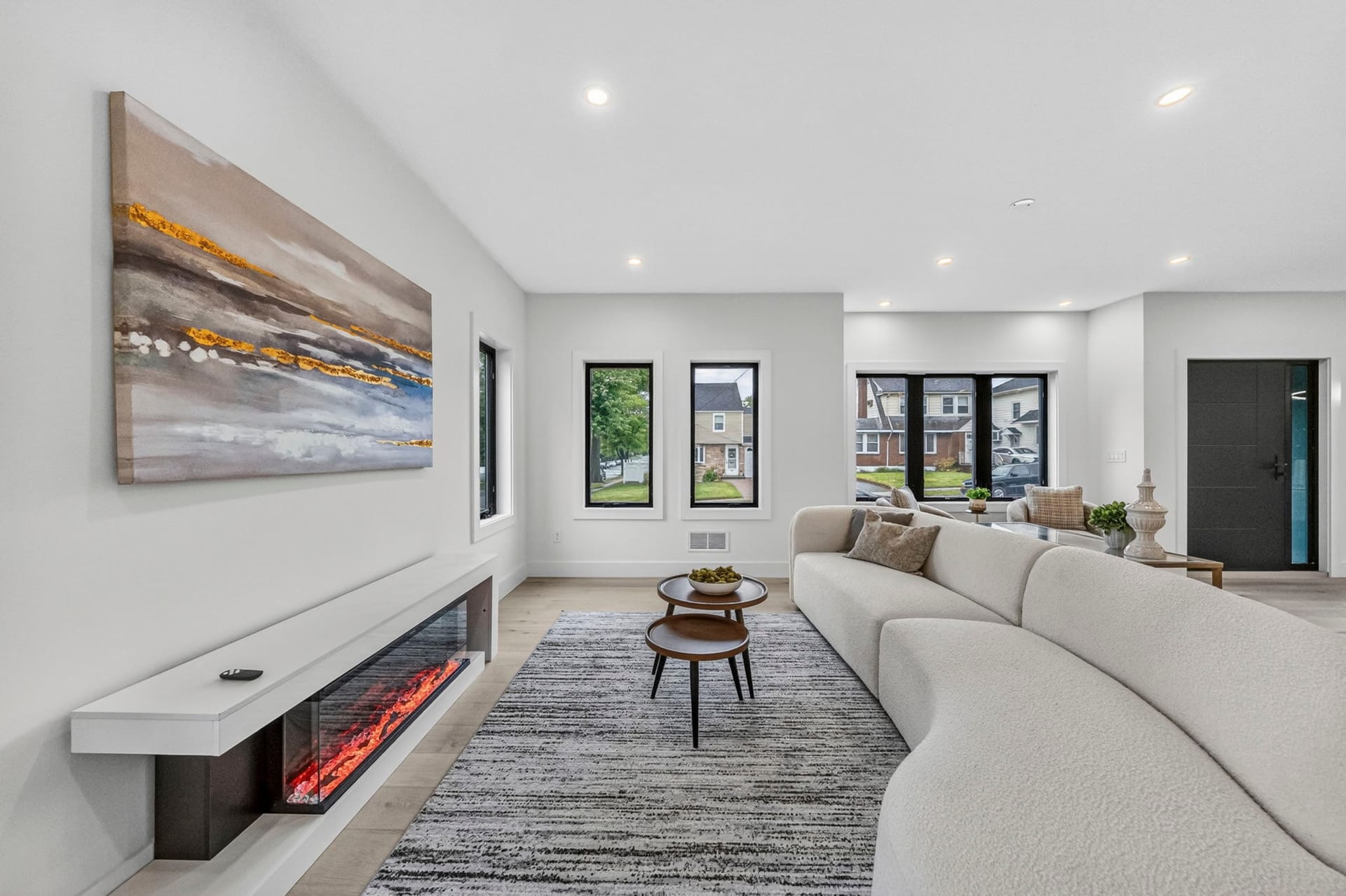 Living room with a stone-and-wood fireplace surround