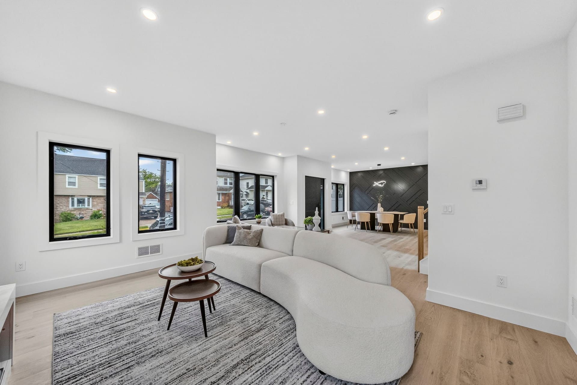Living room seating area with a sectional sofa and round coffee table