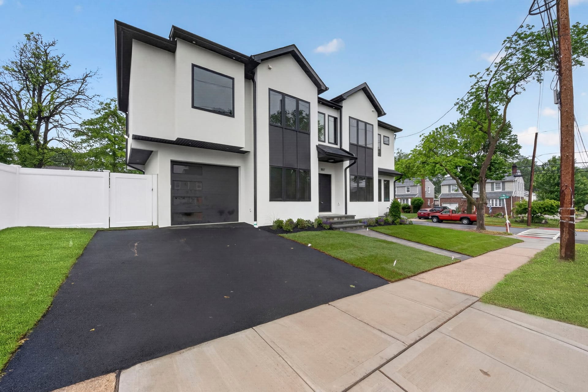 Front and side exterior view of 887 Linden Avenue from the driveway